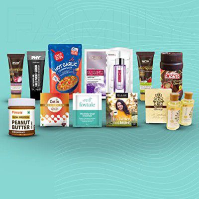 Mojo Box gift combo includes Lemon green tea, Hair Shampoos, Face Mask + Scrub, Ayurvedic body oil, Hibiscus infusion bag, Serum Sheet Mask, Schezwan Cooking Sauce, Peanut Butter and Foxtale Cleanser